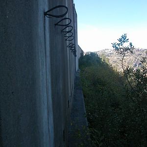 cable guides on the outer wall of a snow shed