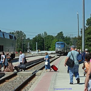 Amtrak 365 pulls out west as 350 loads and heads east