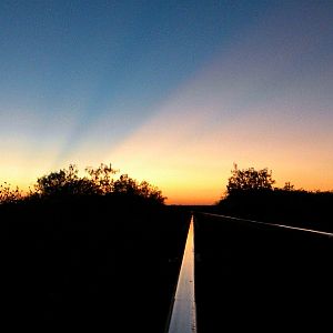 Sun setting on the rails