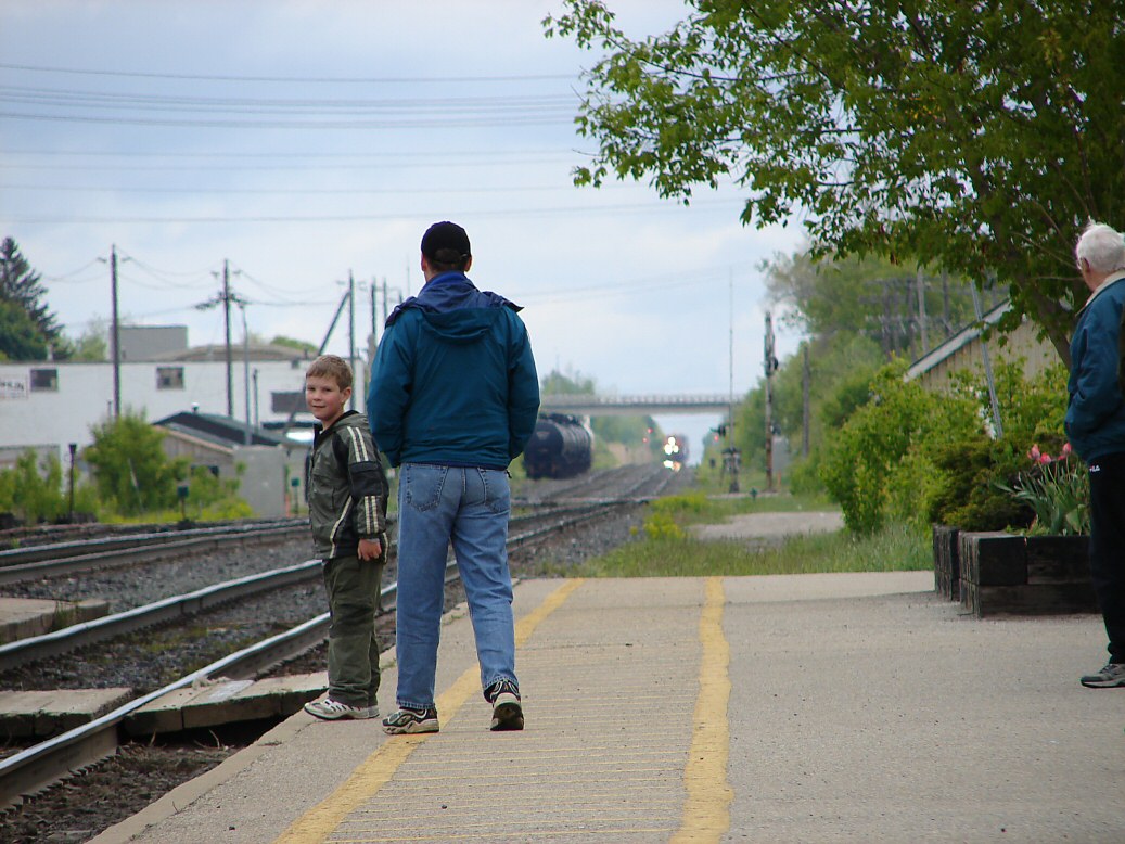 Father & Son Waiting For A Train