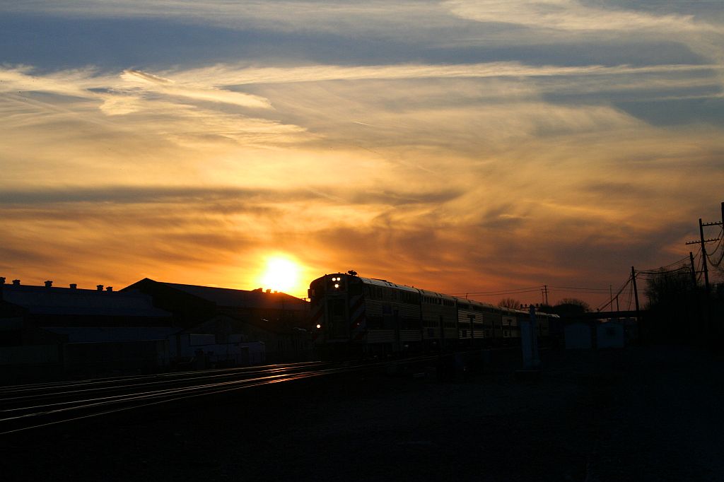 Metra heads east during sunset.