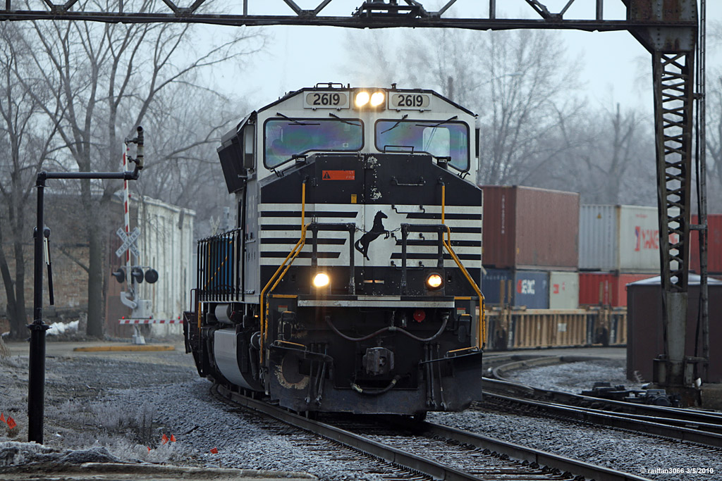 NS 2619 stack train heading west by us at the depot