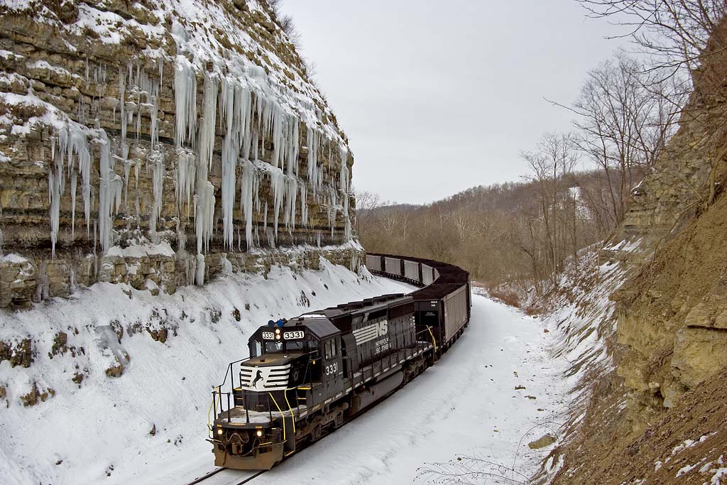 NS 3331 passes past huge icicles